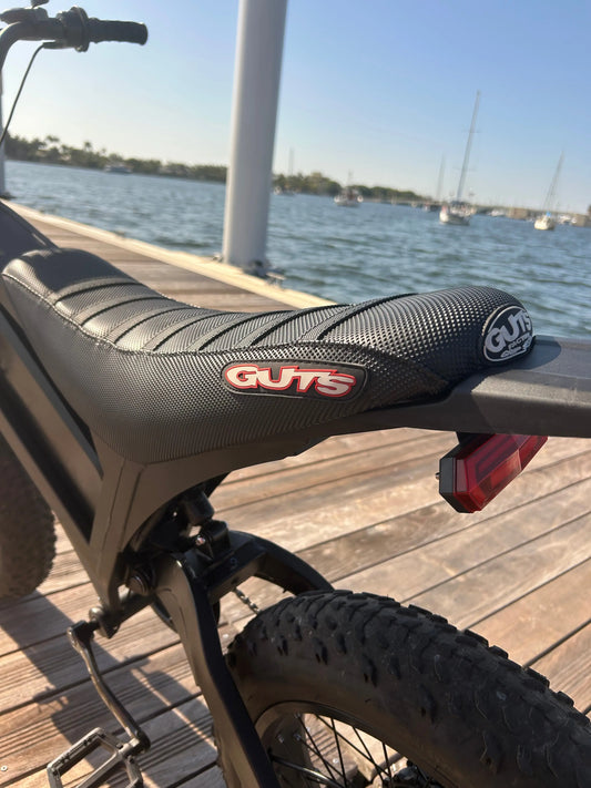 Zorix seat cover on a Zorix R8 ebike, durable fabric and secure attachment straps.
